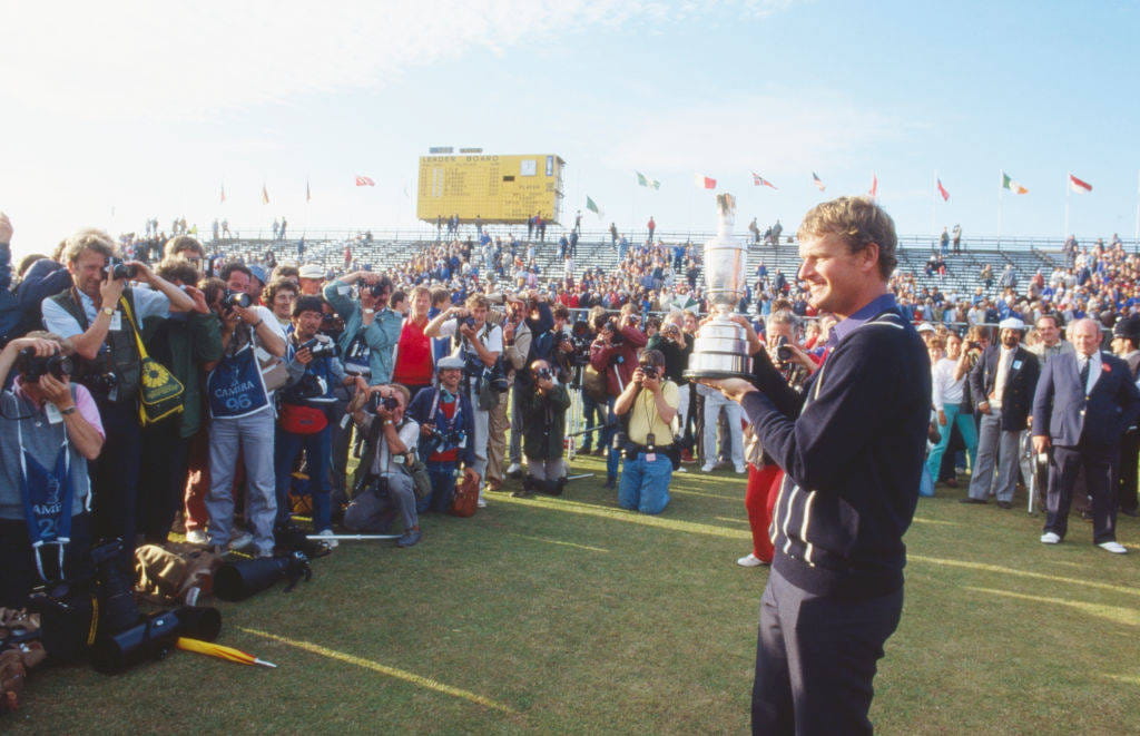 Sandy Lyle poses with the Claret Jug after winning The Open